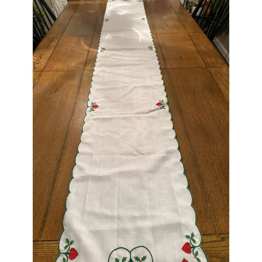 Table runner appliqued with red hearts and embroidered holly leaves 88” X 13.5”